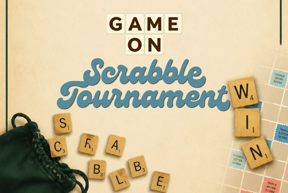 Game On Scrabble Tournament poster featuring tiles spelling 'Scrabble' and 'Win.' A green tile bag and part of a Scrabble board are visible.