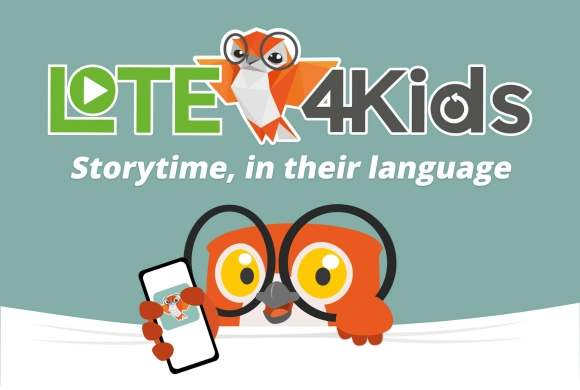 Text "Lote4Kids Storytime in their language. Follwedy by a graphic of an OWL holding a smartphone with an open storybook on the phone.